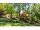 Beautiful home with mature landscaping and stone accents at 7624 William Penn Pl, Indianapolis, IN 46256