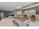 Spacious basement game room with a pool table and seating area, great for leisure and entertainment at 7624 William Penn Pl, Indianapolis, IN 46256