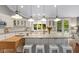 Large kitchen island with granite countertops and seating for four at 7624 William Penn Pl, Indianapolis, IN 46256