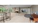Spacious living room with a full bar, fireplace, and neutral tones creating a comfortable setting at 7624 William Penn Pl, Indianapolis, IN 46256