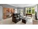 Cozy living room with plush seating, built-in shelves, and natural light at 7624 William Penn Pl, Indianapolis, IN 46256