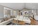 Open-concept living room showcases seamless flow into the modern kitchen, perfect for entertaining at 7624 William Penn Pl, Indianapolis, IN 46256