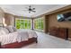 Large main bedroom with abundant natural light, a dresser and an adjoining sitting area at 7624 William Penn Pl, Indianapolis, IN 46256