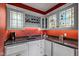 Unique wet bar with wine rack, marble countertop, and built-in shelves at 7624 William Penn Pl, Indianapolis, IN 46256