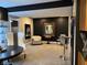 Finished basement featuring a stylish sitting area with dark accent wall and a decorative table display at 7661 Carriage House Way, Zionsville, IN 46077