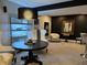 Finished basement featuring a stylish sitting area with dark accent wall and a decorative table display at 7661 Carriage House Way, Zionsville, IN 46077