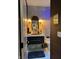 Chic powder room featuring a decorative mirror, modern fixtures, and unique wall sconces at 7661 Carriage House Way, Zionsville, IN 46077