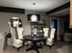 Cozy dining area features a round table, comfortable seating, and modern lighting at 7661 Carriage House Way, Zionsville, IN 46077