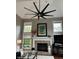 Spacious living room with cathedral ceiling, fireplace, and extra large fan at 7661 Carriage House Way, Zionsville, IN 46077