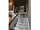 Stairway with a unique carpet runner and a contemporary railing at 7661 Carriage House Way, Zionsville, IN 46077