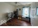 Bright room featuring hardwood floors, a ceiling fan, and a window seat with storage at 7733 Sergi Canyon Dr, Indianapolis, IN 46217