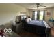 Cozy main bedroom with a queen bed, dresser, and natural light from the windows at 7733 Sergi Canyon Dr, Indianapolis, IN 46217