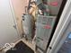 A view of the home's utility room featuring the hot water heater and furnace at 7733 Sergi Canyon Dr, Indianapolis, IN 46217