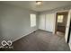 Carpeted bedroom with closet at 7842 Brennan Rd, Indianapolis, IN 46219