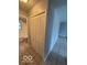 Hallway with closet and access to bathroom at 7842 Brennan Rd, Indianapolis, IN 46219