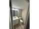 A clean, well-lit half bathroom featuring a white vanity, modern faucet, mirror, and neutral wall tones at 8030 Winchester Pl, Indianapolis, IN 46227