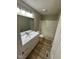 Clean bathroom with modern vanity, updated faucet, and shower with tub at 8030 Winchester Pl, Indianapolis, IN 46227