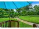Lush backyard featuring a bench on a stone path, surrounded by greenery and trees at 8266 Glacier Ridge Dr, Fishers, IN 46038
