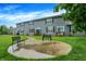 Inviting backyard features a patio, green lawn, and well-maintained landscaping perfect for outdoor enjoyment at 8266 Glacier Ridge Dr, Fishers, IN 46038