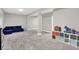Finished basement offering ample space, with cozy seating and storage solutions at 8266 Glacier Ridge Dr, Fishers, IN 46038
