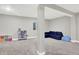 Versatile basement space with carpet, ideal for recreation and storage, featuring natural light at 8266 Glacier Ridge Dr, Fishers, IN 46038