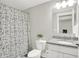 Charming bathroom with modern fixtures, granite counters, and a decorative shower curtain at 8266 Glacier Ridge Dr, Fishers, IN 46038