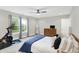 Well-lit bedroom boasts a large window, neutral decor, plus exercise bike and media setup at 8266 Glacier Ridge Dr, Fishers, IN 46038