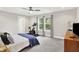 Spacious bedroom with large windows, neutral tones, and carpeted flooring at 8266 Glacier Ridge Dr, Fishers, IN 46038