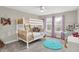 Charming bedroom with a bunk bed, desk area, and plenty of natural light at 8266 Glacier Ridge Dr, Fishers, IN 46038
