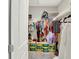Walk in closet with organized storage racks and colorful clothing at 8266 Glacier Ridge Dr, Fishers, IN 46038