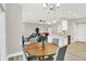 Open-concept dining area with a view into the living room and kitchen, perfect for entertaining guests at 8266 Glacier Ridge Dr, Fishers, IN 46038