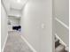 Hallway that leads to a carpeted living area, showcasing the home's neutral color palette at 8266 Glacier Ridge Dr, Fishers, IN 46038