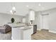 Bright, open kitchen with granite counters, stainless appliances, and seamless flow to living area at 8266 Glacier Ridge Dr, Fishers, IN 46038