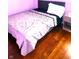 Cozy bedroom featuring a single bed with wood floors and a nightstand at 8357 Harrison Dr, Lawrence, IN 46226