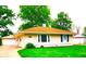 Charming single-story home with a well-maintained lawn and detached garage at 8357 Harrison Dr, Lawrence, IN 46226