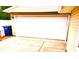 Spacious garage with a white door and a concrete driveway at 8357 Harrison Dr, Lawrence, IN 46226