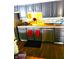 Updated kitchen with stainless steel appliances, dark cabinets, and tile backsplash at 8357 Harrison Dr, Lawrence, IN 46226