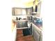 Modern kitchen features dark cabinets, stainless steel appliances, and a gas range at 8357 Harrison Dr, Lawrence, IN 46226