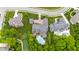 Birds-eye view showcasing a home with a private pool, lush landscaping, and adjacent golf course at 860 Chatham Hills Blvd, Westfield, IN 46074