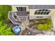 Aerial view of a home featuring a backyard, stairs, pond and hot tub at 860 Chatham Hills Blvd, Westfield, IN 46074