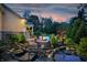Outdoor space showing a private pool, landscaped garden, outdoor fireplace and seating area for relaxation at 860 Chatham Hills Blvd, Westfield, IN 46074