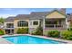 Inviting backyard with a private pool, covered patio, lush landscaping and a charming staircase at 860 Chatham Hills Blvd, Westfield, IN 46074