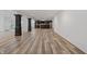 Spacious finished basement with an open layout, featuring dark wood columns, new flooring, and a kitchenette at 860 Chatham Hills Blvd, Westfield, IN 46074