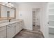 Bathroom features a white vanity, linen closet and spacious shelves at 860 Chatham Hills Blvd, Westfield, IN 46074