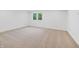 Carpeted bedroom with natural light provided by a window showcasing greenery outside at 860 Chatham Hills Blvd, Westfield, IN 46074