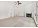 Expansive bedroom with a fireplace, carpeted floors, and natural light streaming through French doors at 860 Chatham Hills Blvd, Westfield, IN 46074