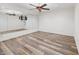 Spacious bonus room featuring a large mirror, ceiling fan, and stylish, modern flooring at 860 Chatham Hills Blvd, Westfield, IN 46074