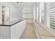 Walk-in closet featuring built-in window seat, black countertop, and ample shelving for storage at 860 Chatham Hills Blvd, Westfield, IN 46074