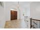 Bright and airy foyer featuring high ceilings, a staircase, and a tiled floor and double front doors at 860 Chatham Hills Blvd, Westfield, IN 46074