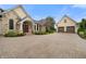 Attractive home featuring a circular driveway, well-maintained landscaping, and stone and shingle facade at 860 Chatham Hills Blvd, Westfield, IN 46074